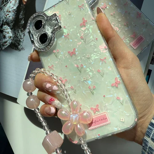 قاب آیفون گل و پروانه زمینه صدفی دوربین استندشو با آویز