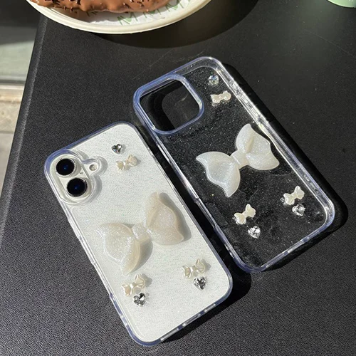 قاب آیفون شفاف با پاپیون سفید و نگیندار